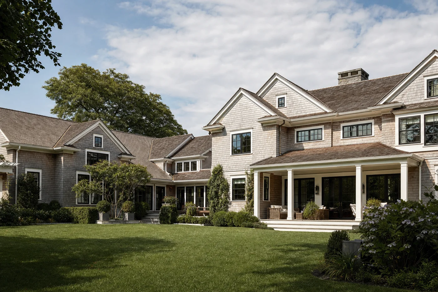 New two-story addition seamlessly blended with an existing shingle-style Long Island estate